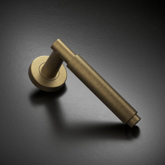 Howdens Fuller and Forge Orta Antique Brass Fluted Lever on Rose Door Handle Pair Howdens