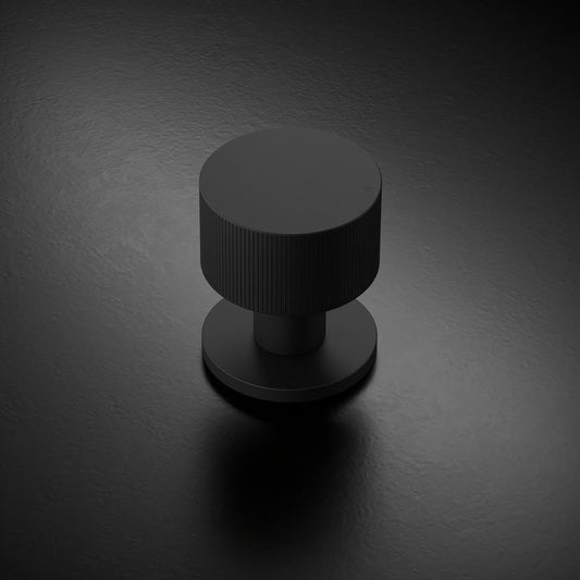Howdens Fuller and Forge Orta Matt Black 50mm Fluted Round Mortice Knob on Slim Rose Pair Howdens