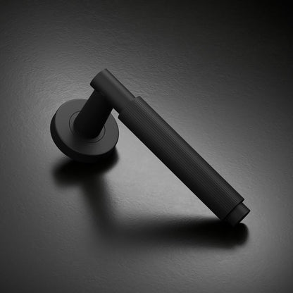 Howdens Fuller and Forge Orta Matt Black Fluted Lever on Rose Door Handle Pair Howdens