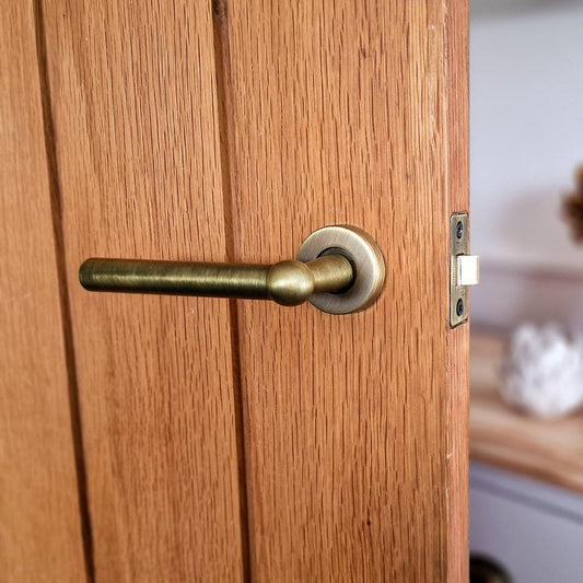 Howdens Fuller and Forge Como Antique Brass Lever on Rose Door Handle Pair Howdens