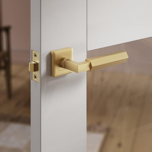 Fuller and Forge Tanaro Satin Brass Hexagonal Lever on Rose Door Handle Pair Howdens