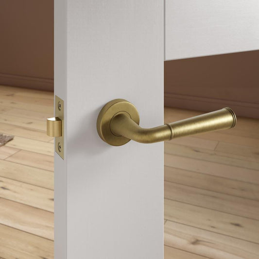 Howdens Fuller and Forge Arno Antique Brass Lever on Rose Door Handle Pair Howdens