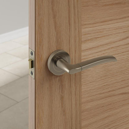 Howdens Newington Antique Brass Lever on Rose Door Handle Pair