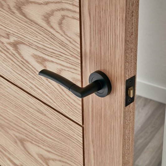 Howdens Newington Matt Black Lever on Rose Door Handle Pair
