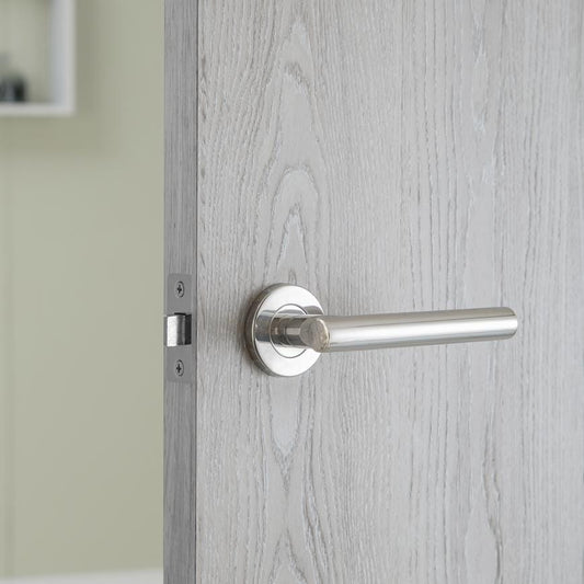 Howdens Lecco Polished Stainless Steel Fire Rated Lever on Rose Door Handle Pair