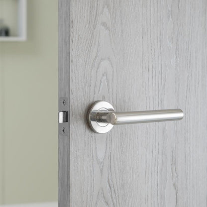 Howdens Lecco Polished Stainless Steel Fire Rated Lever on Rose Door Handle Pair