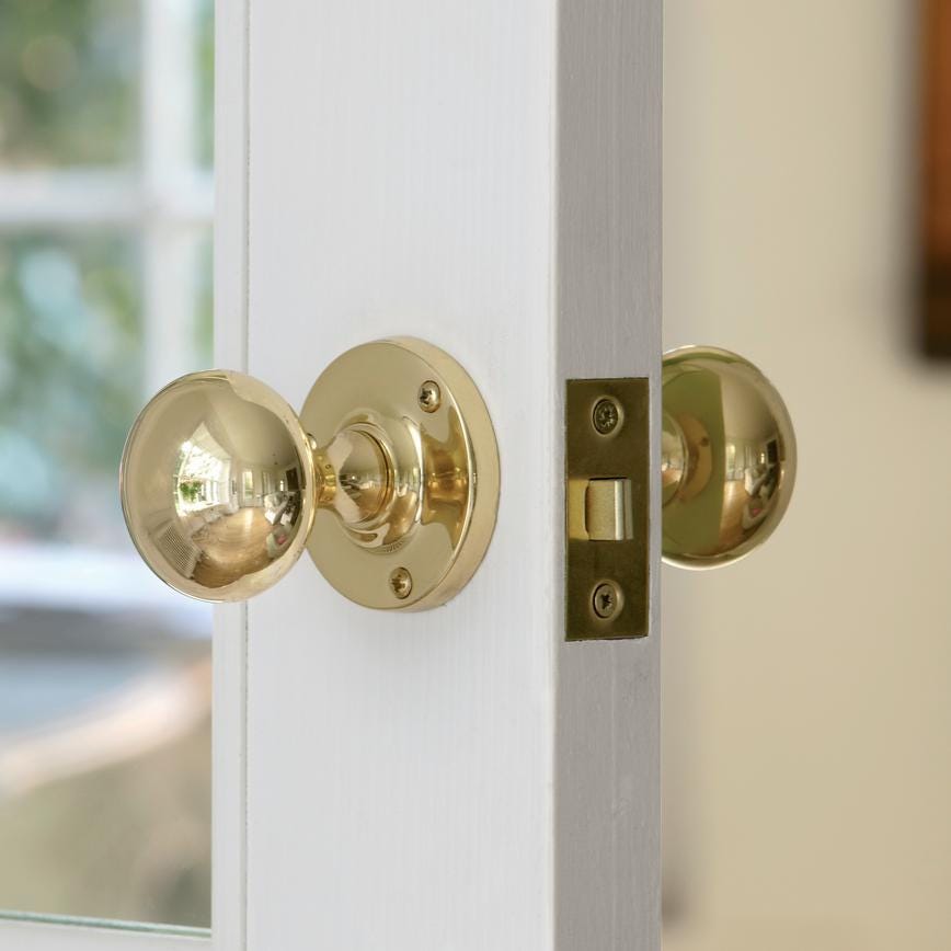 Howdens Victorian Polished Brass 62mm Round Mortice Knob on Rose Pair