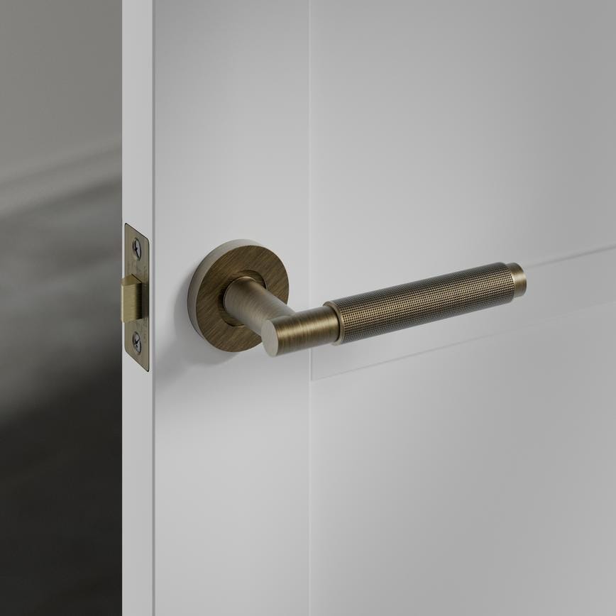Howdens Fuller and Forge Iseo Antique Brass Knurled Lever on Rose Door Handle Pair Howdens