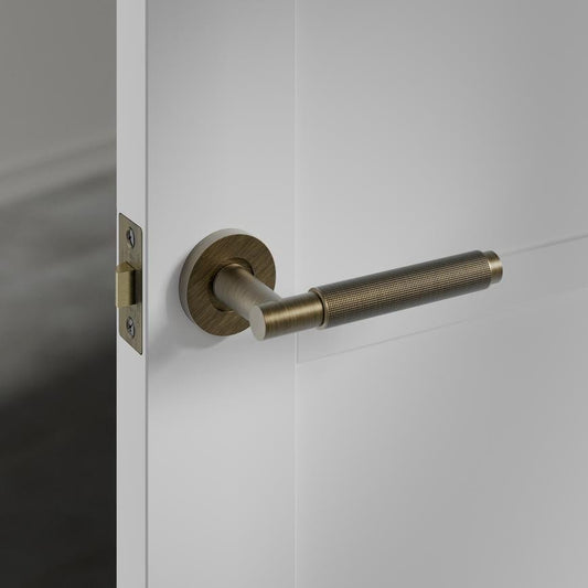 Howdens Fuller and Forge Iseo Antique Brass Knurled Lever on Rose Door Handle Pair Howdens