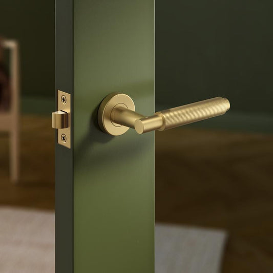 Howdens Fuller and Forge Orta Satin Brass Fluted Lever on Rose Door Handle Pair Howdens