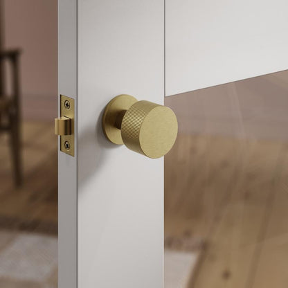 Howdens Fuller and Forge Orta Antique Brass 50mm Fluted Round Mortice Knob on Slim Rose Pair Howdens