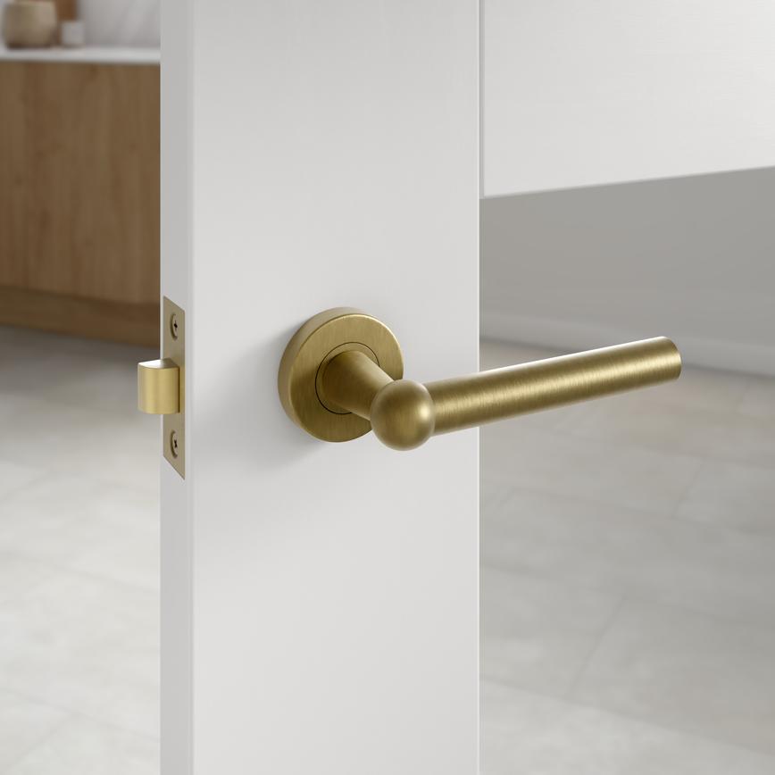 Howdens Fuller and Forge Como Antique Brass Lever on Rose Door Handle Pair Howdens