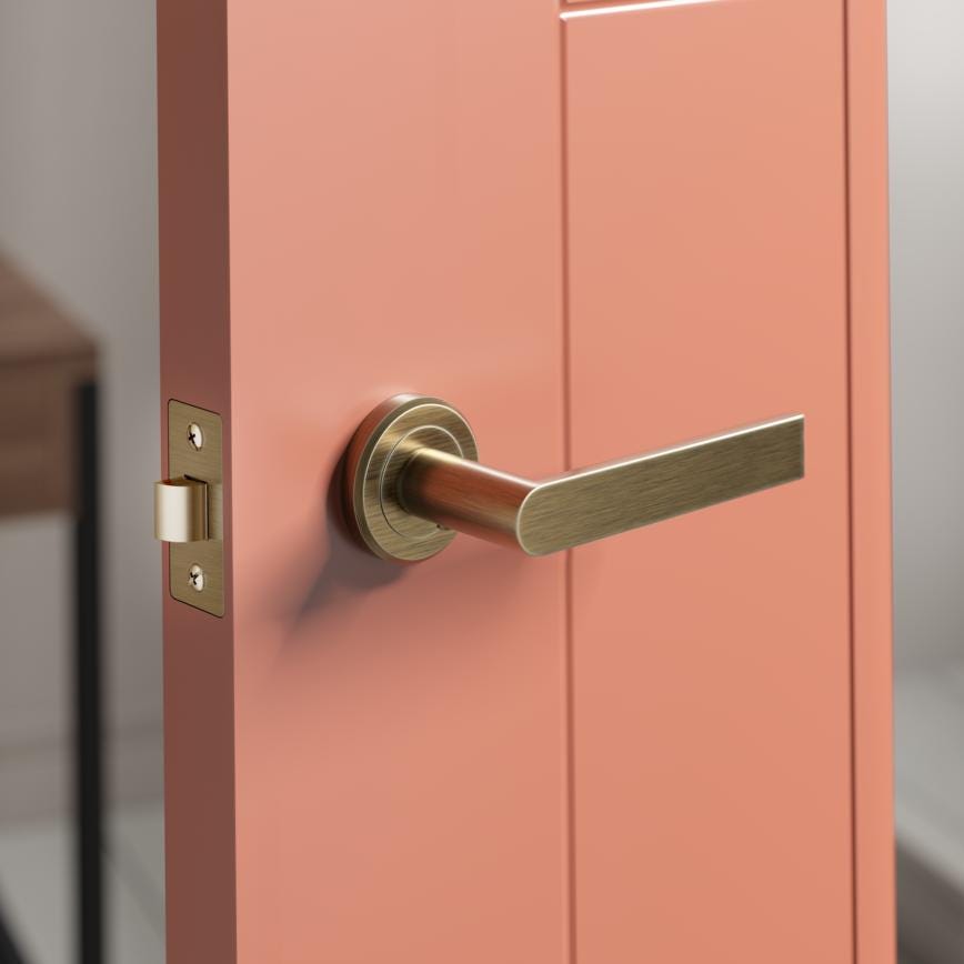 Howdens Carlisle Brass Serozzetta Edge Antique Brass Fire Rated Lever on Rose Door Handle Pair