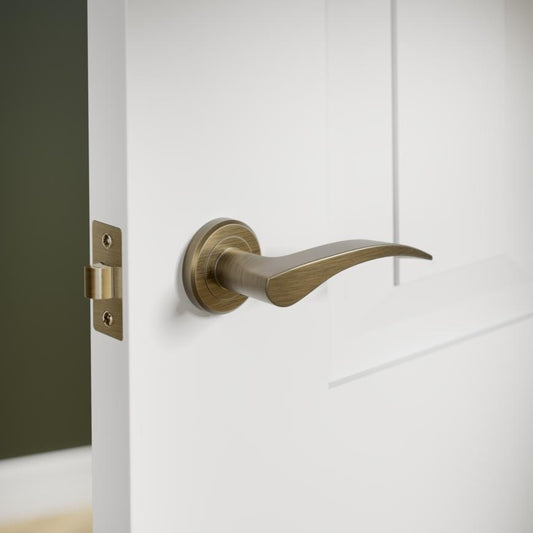 Howdens Carlisle Brass Serozzetta Olivier Antqiue Brass Fire Rated Lever on Rose Door Handle Pair